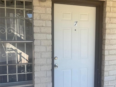 Property entrance with brick siding