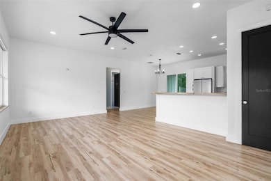 Living room as you walk in front door and looking at kitchen and bedroom 2 and 3