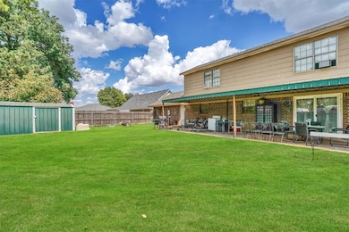 View of yard featuring a storage unit and a patio