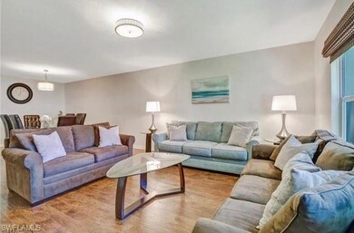 Living room featuring light hardwood / wood-style 