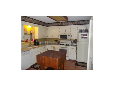Lots of cabinets with granite counter tops and pan