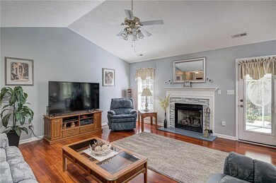 From living room, the doorway to the right leads to rear large screened porch/sunroom.