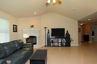 Another view of this family room.  Cast stone-like fireplace offers gas connections.