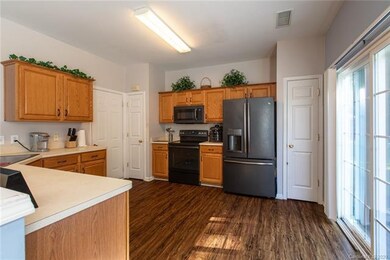 Open Kitchen with new Back Stainless Appliances.