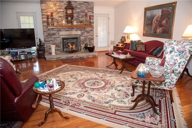 Grate Room with center piece fireplace and entry d