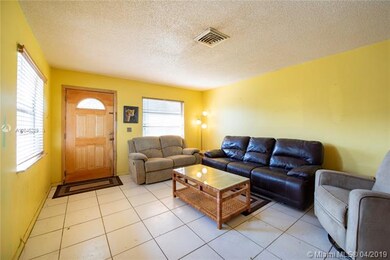 Front door, living room, tile throughout