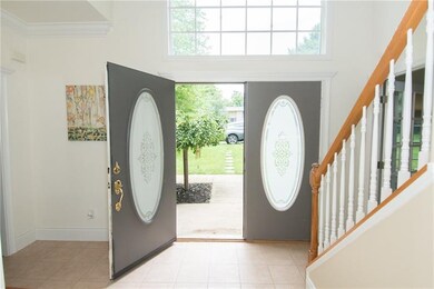 The expansive entryway offers plenty of room to re