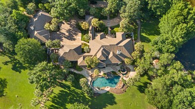 Gorgeous aerial of the main house, guest house, pool and spa.
