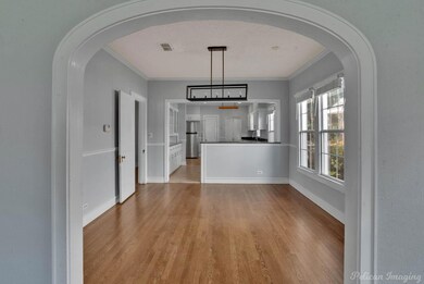 Gorgeous archway leading to dining area and kitche