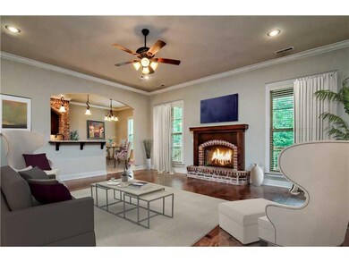 Living Room. Stunning living room with hardwood floors and easy access to both the kitchen and the back patio.
