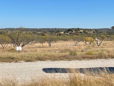 View of road with a view of countryside; utilities ready to be tapped into.