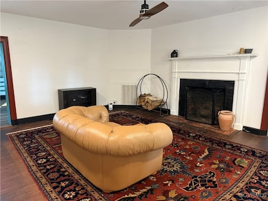 Living area with hardwood / wood-style flooring, a