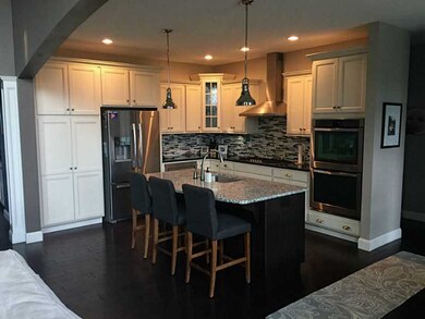 Kitchen. This open concept kitchen has cream and e
