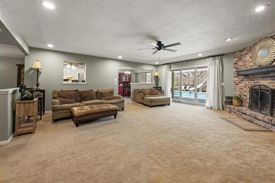 Living room looking into dinette area in kitchen a