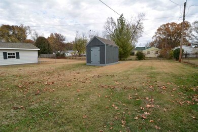 This large back yard has a nice large shed equippe