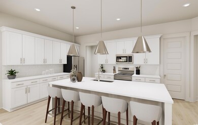 Kitchen featuring hanging light fixtures, applianc