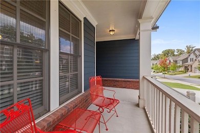 Covered porch featuring a residential view