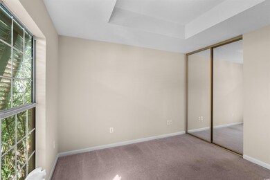 Unfurnished bedroom with carpet floors and a close