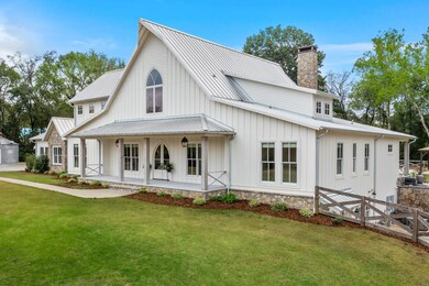 The beautiful modern farmhouse boasts unique touches of reclaimed history designed to look and feel like an original farmhouse.