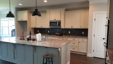 Alternate view of kitchen. Pantry. Breakfast nook, too, for informal meals.