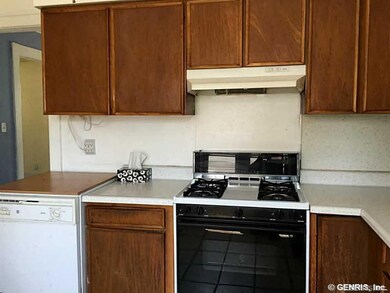 Kitchen. Work station with gas stove and range hoo
