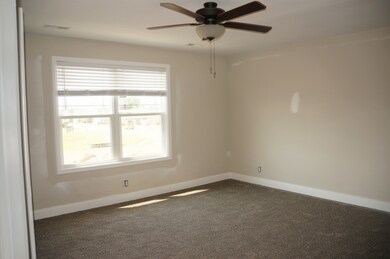Large Second Bedroom upstairs with double walk in closets and a full bathroom.