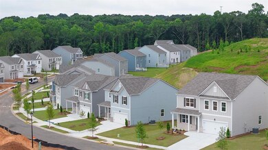 Aerial view of residential area with a heavily woo