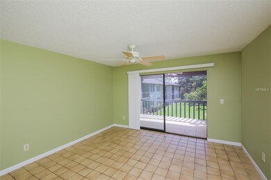Large living room with sliders to screened lanai a