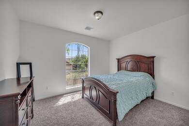 Bedroom featuring visible vents, baseboards, and 