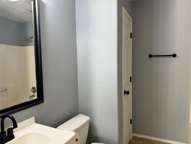 Bathroom with sink and toilet