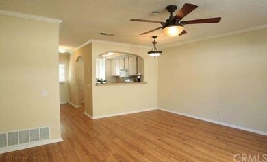 Living Room Facing Kitchen and Entry