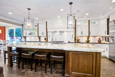 Features include huge center island w/ gorgeous sl