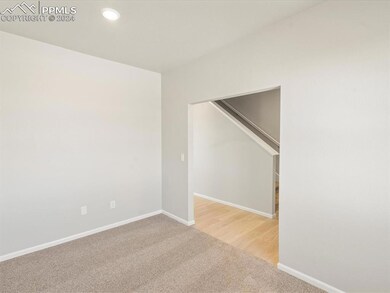 Empty room featuring wood-type flooring