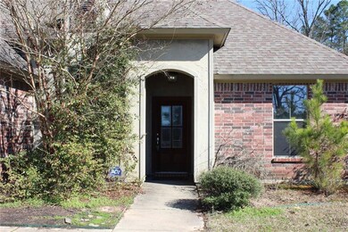 FRONT: Entryway has pretty archway