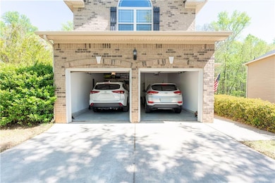 Garage featuring driveway