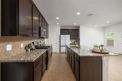 Kitchen with appliances with stainless steel fini