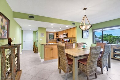 Dining area with sink and light tile patterned flo