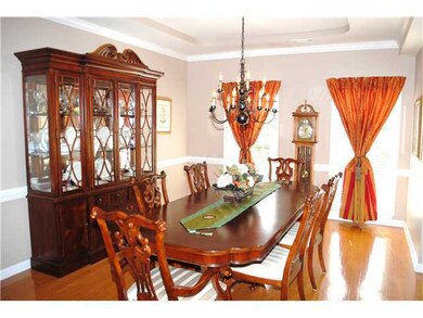 Very spacious formal dining room with wood floors 