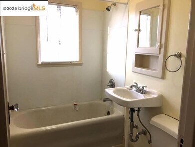 Full bathroom featuring healthy amount of natural light and shower / washtub combination