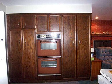 Kitchen. DOUBLE OVENS W/FOLD OUT PANTRY.
