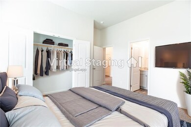 En suite bedroom to the right of the entry