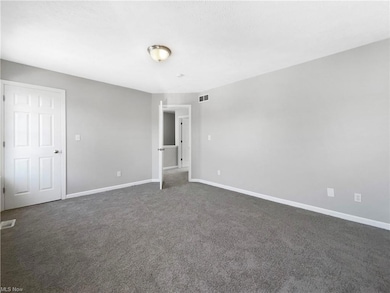 Unfurnished room with carpet flooring