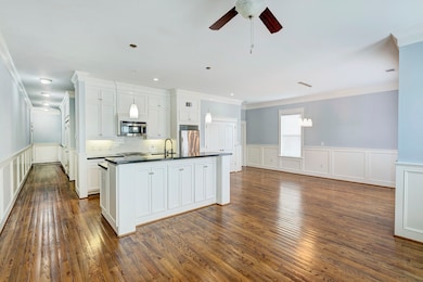 Large island kitchen is open to the living and din