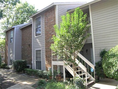 VIEW FROM PARKING AREA AND DRIVEWAY .  GO UPSTAIRS