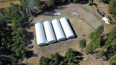 Land and greenhouses