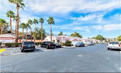 View of asphalt street featuring a residential vie