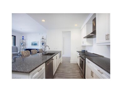 Kitchen looking toward entry door.