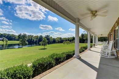 The Front Porch runs the length of the house with ample space for multiple seating arrangements.  Easy maintenance vinyl ceiling with two ceiling fans.  Overhead lighting with the fans, and carriage lighting at the front door.