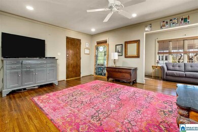 Crown moulding and hardwood floors make this a com