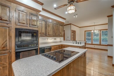 Kitchen featuring sink, a center island, ceiling f